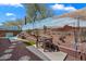 Private backyard with a mural wall, spa pool, patio dining set, and desert landscaping at 2328 W Calle Marita --, Phoenix, AZ 85085