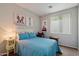 Cozy bedroom with large window and decoratively painted dog pictures on wall at 2328 W Calle Marita --, Phoenix, AZ 85085