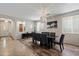Bright dining room with a modern light fixture and plaid chairs at 2328 W Calle Marita --, Phoenix, AZ 85085