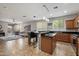 Open concept kitchen with island and easy access to the living room at 2328 W Calle Marita --, Phoenix, AZ 85085
