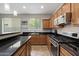 Kitchen featuring stainless steel appliances and granite countertops at 2328 W Calle Marita --, Phoenix, AZ 85085