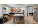 Kitchen featuring island, stainless appliances, and open layout at 2328 W Calle Marita --, Phoenix, AZ 85085