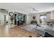 Bright living room features a ceiling fan, decorative shelving and sliding door to outside at 2328 W Calle Marita --, Phoenix, AZ 85085