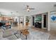 Open concept living room and kitchen features tile flooring, decorative shelving and eat-in bar at 2328 W Calle Marita --, Phoenix, AZ 85085