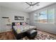 Comfortable bedroom with ceiling fan, and stylish decor at 2328 W Calle Marita --, Phoenix, AZ 85085