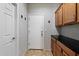 Mud room featuring cabinets, black countertop, and tile floor at 2328 W Calle Marita --, Phoenix, AZ 85085