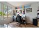 Bright office featuring a large window with backyard views and hardwood-style floors at 2328 W Calle Marita --, Phoenix, AZ 85085