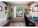 Home office features a large window with backyard views, dark wood floors and neutral walls at 2328 W Calle Marita --, Phoenix, AZ 85085