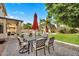 Charming backyard dining area with a comfortable seating arrangement and lush greenery at 2440 E Stephens Pl, Chandler, AZ 85225