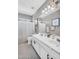 Bright bathroom featuring double sinks, modern fixtures, and stylish tile floors at 2440 E Stephens Pl, Chandler, AZ 85225