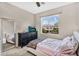 Comfortable bedroom with natural light, dresser, and neutral walls, creating a relaxing and inviting space at 2440 E Stephens Pl, Chandler, AZ 85225