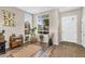 Inviting foyer with hardwood floors, bright windows, neutral colors, and decorative plants at 2440 E Stephens Pl, Chandler, AZ 85225