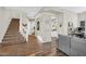 Spacious hallway with staircase, neutral paint, and stylish decor, blending comfort and elegance at 2440 E Stephens Pl, Chandler, AZ 85225