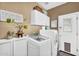 Convenient laundry area with modern appliances and ample storage space at 2440 E Stephens Pl, Chandler, AZ 85225