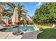 Beautiful pool surrounded by lush landscaping and ample seating areas at 2440 E Stephens Pl, Chandler, AZ 85225