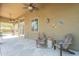 A covered back patio features comfortable seating and tranquil views, perfect for outdoor relaxation at 2735 E Flower Ct, Gilbert, AZ 85298
