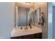 Bathroom featuring a vanity with drawers, sink, and a large mirror at 2735 E Flower Ct, Gilbert, AZ 85298