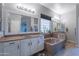 Bright bathroom features double vanity sinks, soaking tub with granite counters, and plenty of natural light at 2735 E Flower Ct, Gilbert, AZ 85298