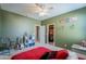 View of a spacious bedroom featuring carpet, olive-colored walls, and a closet at 2735 E Flower Ct, Gilbert, AZ 85298
