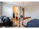 Bright bedroom with home office setup and an adjoining bathroom at 2735 E Flower Ct, Gilbert, AZ 85298