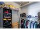 Walk-in closet featuring built-in shelving for storing clothing, shoes, and accessories at 2735 E Flower Ct, Gilbert, AZ 85298