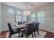 Elegant dining room features a modern chandelier, stylish decor and plenty of natural light at 2735 E Flower Ct, Gilbert, AZ 85298