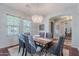 Dining room features modern chandelier and stylish decor, as well as view into other rooms at 2735 E Flower Ct, Gilbert, AZ 85298