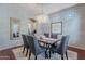 Elegant dining room features a modern chandelier, stylish decor and plenty of natural light at 2735 E Flower Ct, Gilbert, AZ 85298
