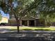 Charming two-story home featuring a well-manicured lawn, stone accents, and a spacious driveway at 2735 E Flower Ct, Gilbert, AZ 85298