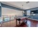 The game room includes a pool table, hardwood floors, recessed lighting, dark blue walls and a view below at 2735 E Flower Ct, Gilbert, AZ 85298