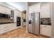 Well-lit kitchen featuring stainless steel appliances, white cabinets, and granite countertops at 2735 E Flower Ct, Gilbert, AZ 85298