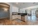 Open kitchen showcasing white cabinets, granite countertops, and a stainless steel dishwasher at 2735 E Flower Ct, Gilbert, AZ 85298