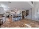 Modern kitchen with white cabinets, a breakfast bar, stainless steel appliances, and seamless flow to other living areas at 2735 E Flower Ct, Gilbert, AZ 85298