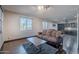 Bright living area with hardwood floors, neutral walls, and comfortable furnishings at 2735 E Flower Ct, Gilbert, AZ 85298