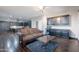 Spacious living area with hardwood floors, custom cabinetry, and ample seating at 2735 E Flower Ct, Gilbert, AZ 85298