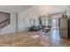 Cozy living room with ample natural light, neutral tones, access to the pool and backyard, with a large sectional sofa at 2735 E Flower Ct, Gilbert, AZ 85298