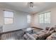 Cozy living area featuring hardwood floors, ample natural light, and comfortable seating at 2735 E Flower Ct, Gilbert, AZ 85298