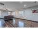 Inviting living room featuring hardwood floors, bright windows, and neutral decor at 2735 E Flower Ct, Gilbert, AZ 85298