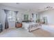 Bright main bedroom with canopy bed, large windows, and neutral decor at 2735 E Flower Ct, Gilbert, AZ 85298