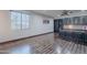 Office space with hardwood floors, a window, a ceiling fan, and built-in shelving and cabinets at 2735 E Flower Ct, Gilbert, AZ 85298