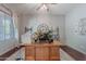 Comfortable home office with a spacious desk, natural light, and classic decor for a productive workspace at 2735 E Flower Ct, Gilbert, AZ 85298