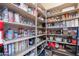 Organized pantry with multiple shelves stocked with a variety of household goods and food items at 2735 E Flower Ct, Gilbert, AZ 85298