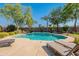 Inviting backyard pool with sun loungers on a spacious patio, creating a relaxing outdoor oasis at 2735 E Flower Ct, Gilbert, AZ 85298