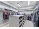 Spacious walk-in closet features hanging racks, plenty of shoe storage, and an abundance of shelving at 2735 E Flower Ct, Gilbert, AZ 85298
