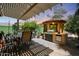 Outdoor area featuring covered patio with barbecue, perfect for entertaining and relaxation at 30248 W Earll Dr, Buckeye, AZ 85396
