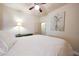 Relaxing bedroom with ceiling fan, accent art, and a warm, inviting ambiance at 30248 W Earll Dr, Buckeye, AZ 85396