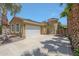 Charming single-Gathering home with desert landscaping, concrete driveway, and an attached two-car garage at 30248 W Earll Dr, Buckeye, AZ 85396