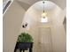 Bright foyer with chandelier lighting, high ceilings, neutral paint, and a decorative plant at 30248 W Earll Dr, Buckeye, AZ 85396