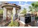 Outdoor kitchen featuring a built-in grill under a gazebo, ideal for backyard entertaining at 30248 W Earll Dr, Buckeye, AZ 85396