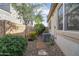 Side yard with low-maintenance landscaping, including gravel, shrubs and stone path at 30248 W Earll Dr, Buckeye, AZ 85396